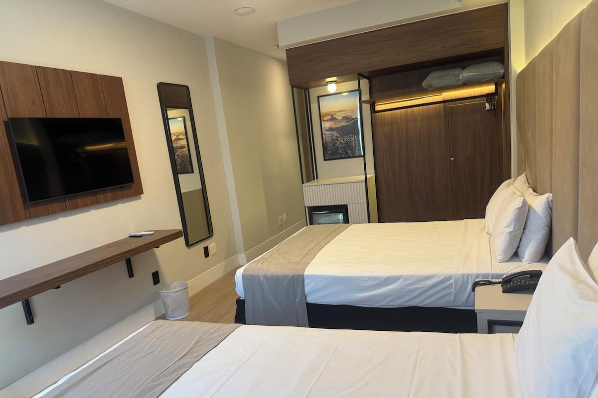 Deluxe Quadruple Room | 1 bedroom, minibar, in-room safe, desk
