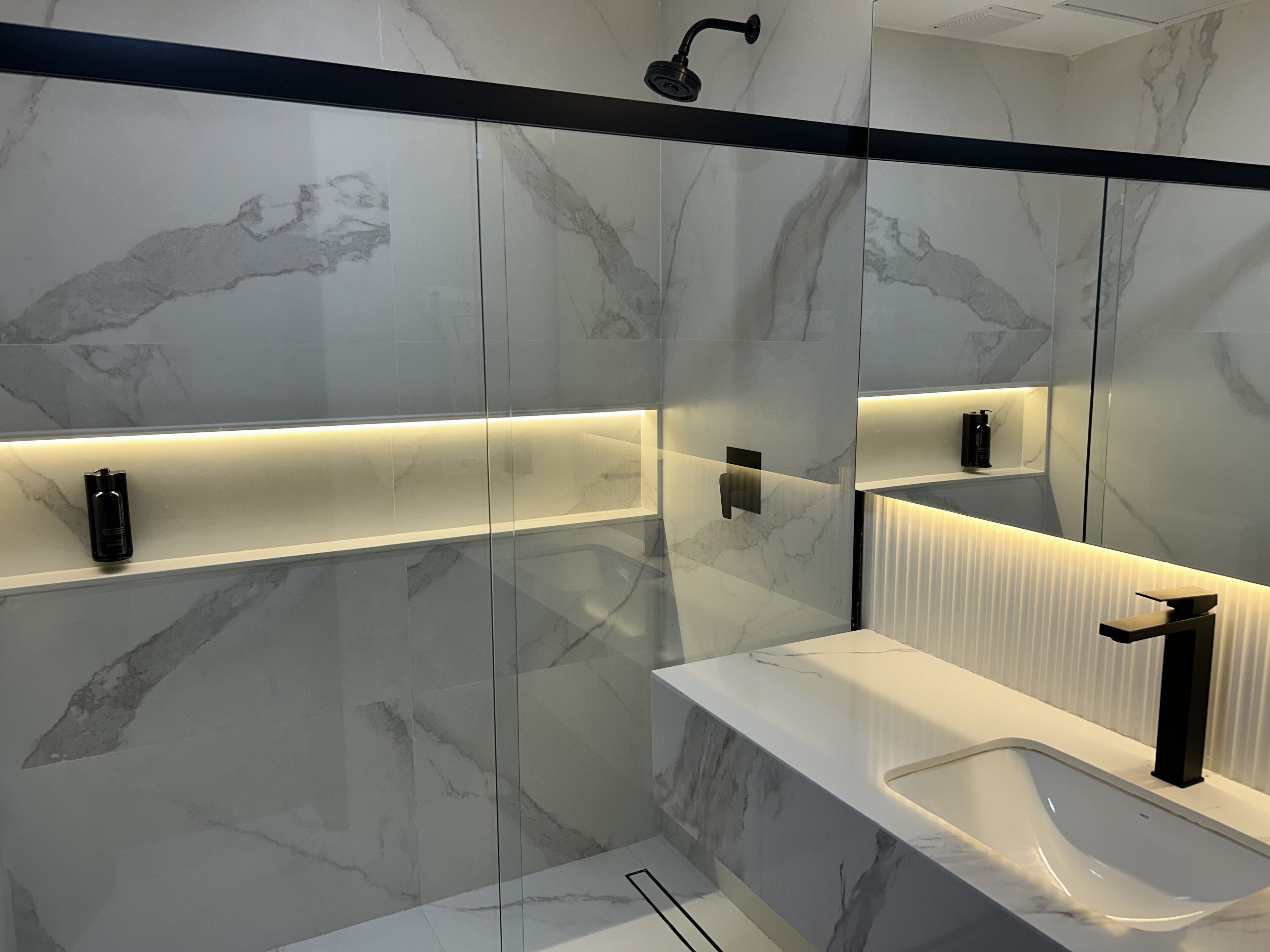 deluxe triple room | bathroom | shower, hair dryer, towels, soap