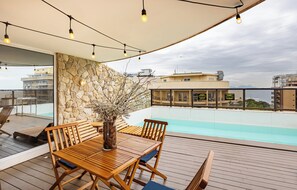 Outdoor pool, open 9:00 AM to 6:00 PM, pool umbrellas, sun loungers