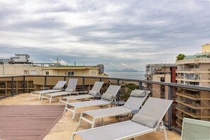 Outdoor pool, open 9:00 AM to 6:00 PM, pool umbrellas, sun loungers