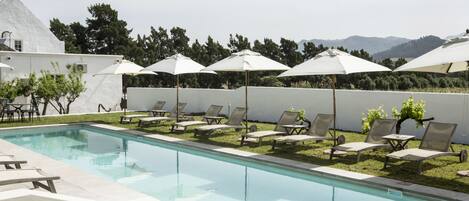 Outdoor pool, pool umbrellas, sun loungers