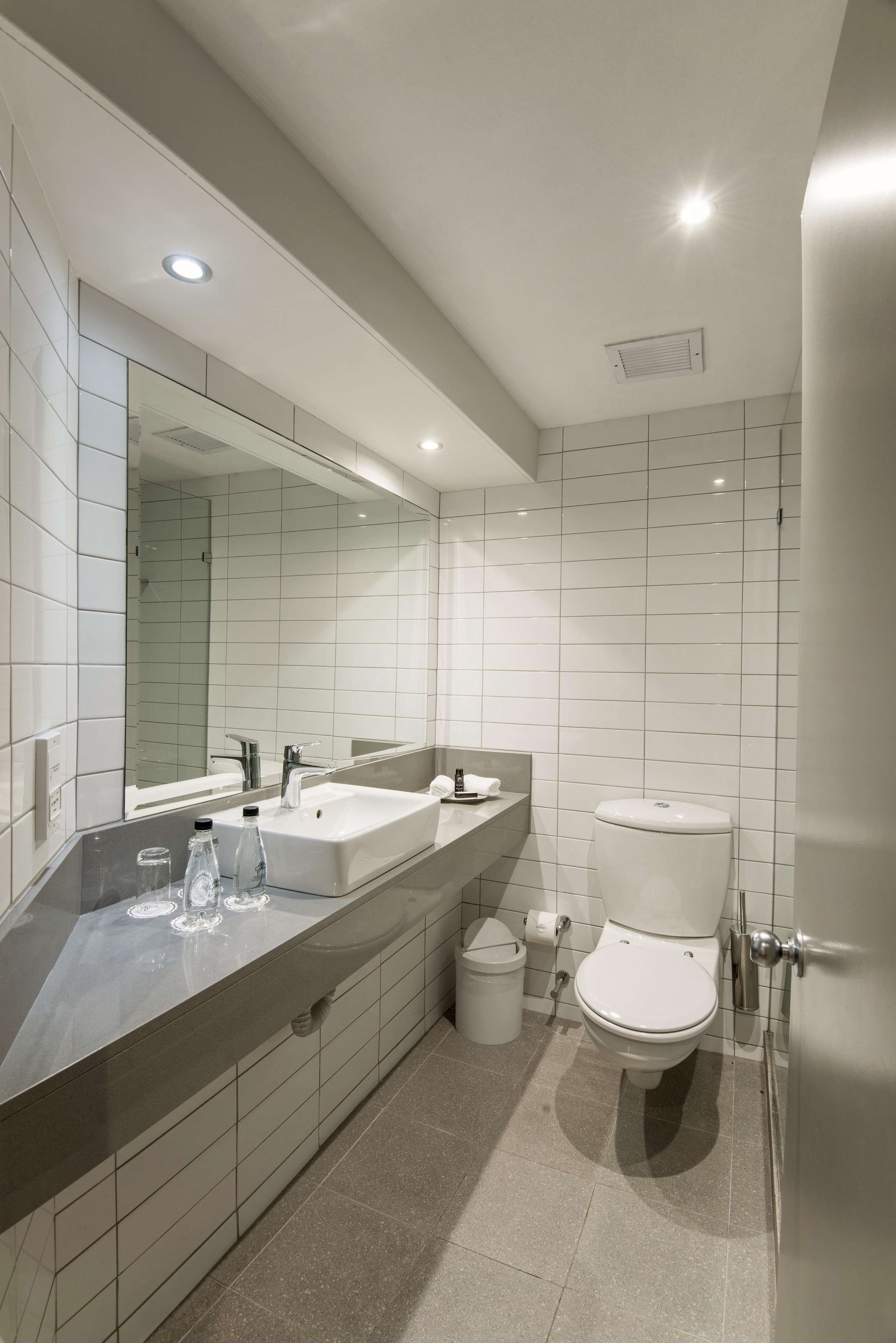 standard queen with shower only | bathroom | designer toiletries, hair dryer, towels, soap