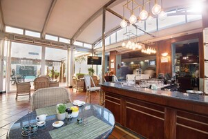 Cocktail bar, poolside views, open daily