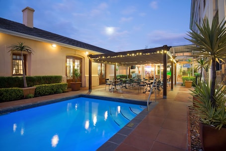 Outdoor pool, pool umbrellas, sun loungers