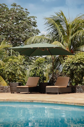 Outdoor pool, pool umbrellas, pool loungers