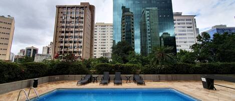Outdoor pool, pool umbrellas, sun loungers