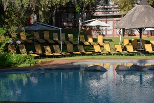Outdoor pool, pool umbrellas, sun loungers