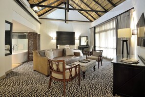 Executive King Suite | Living area | 43-inch flat-screen TV with satellite channels, TV
