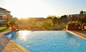 Seasonal outdoor pool, pool loungers