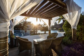 Indoor pool, outdoor pool, pool umbrellas, pool loungers
