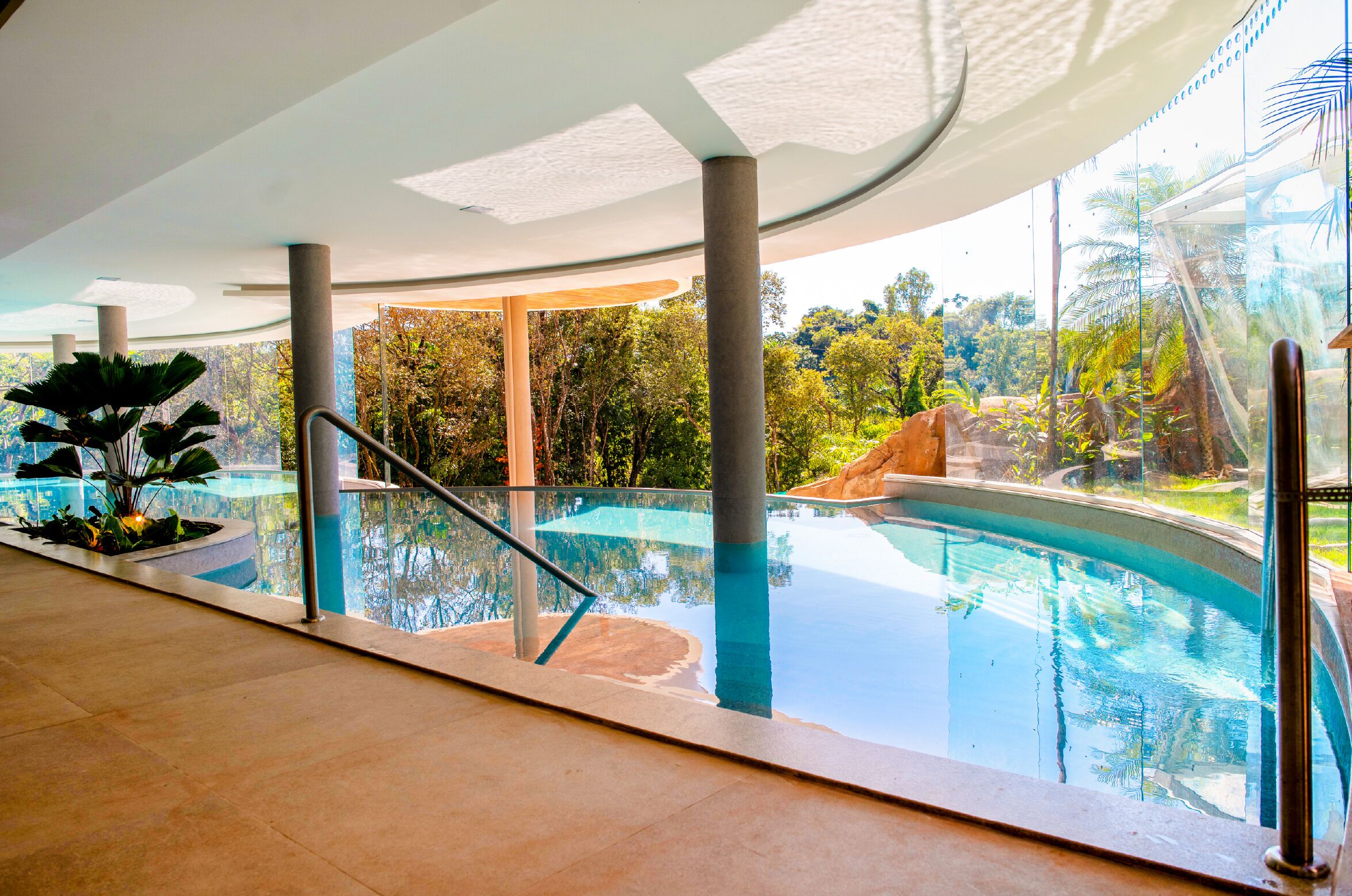 Indoor pool, outdoor pool, pool umbrellas, pool loungers