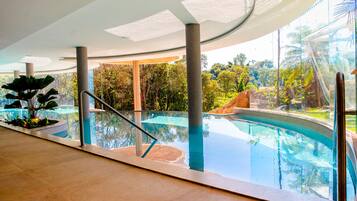 Indoor pool, outdoor pool, pool umbrellas, pool loungers