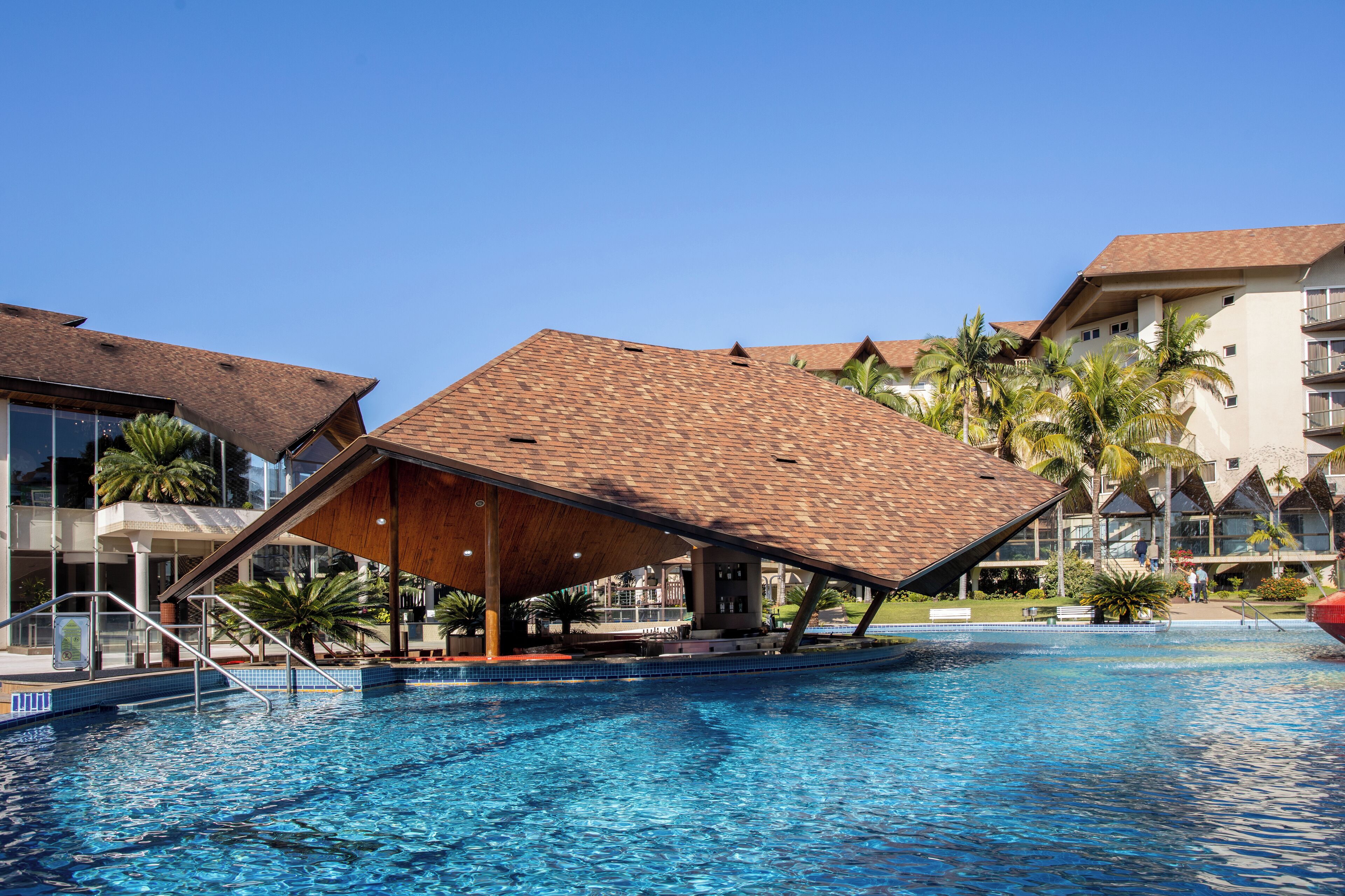 Indoor pool, outdoor pool, pool umbrellas, pool loungers