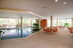 Indoor pool, outdoor pool, pool umbrellas, pool loungers