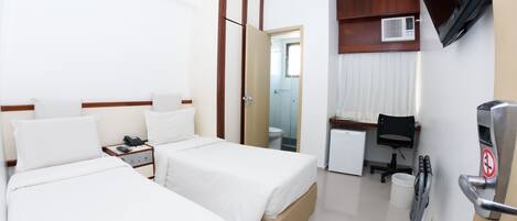 Standard Twin Room | Minibar, in-room safe, desk, blackout drapes