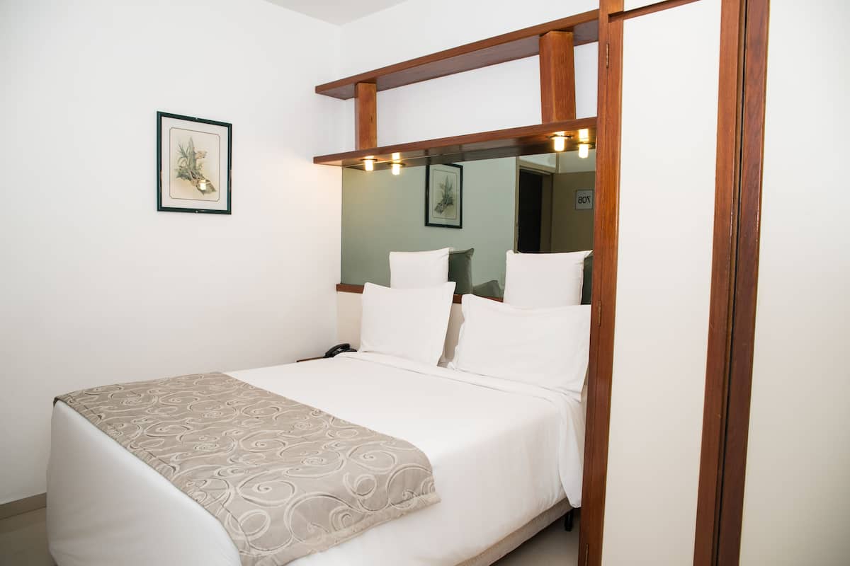 Classic Double Room | Minibar, in-room safe, desk, blackout drapes