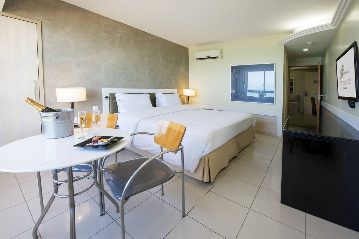 Junior Suite, Oceanfront | Minibar, in-room safe, desk, laptop workspace