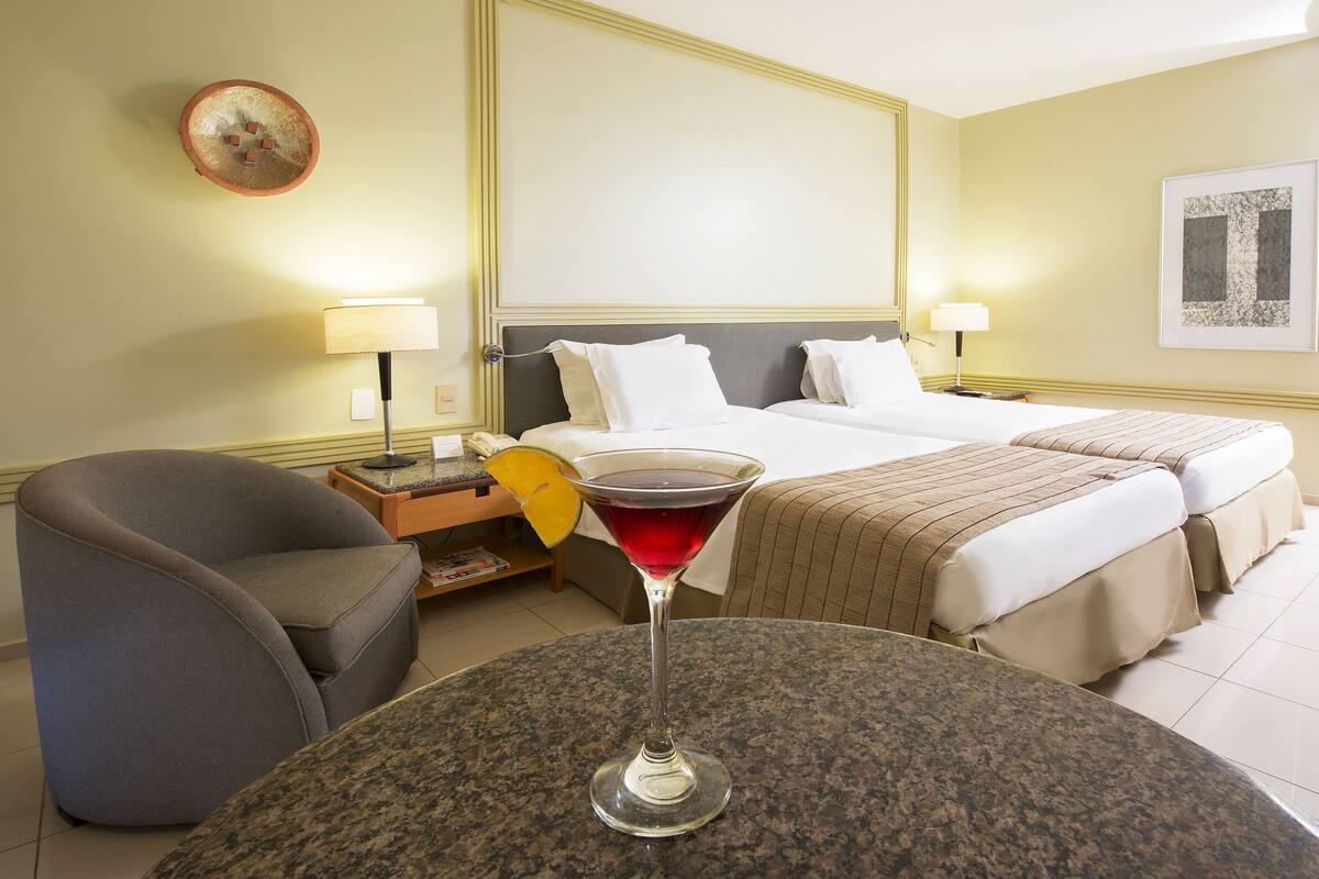 Standard Room, Partial Sea View | Minibar, in-room safe, desk, laptop workspace