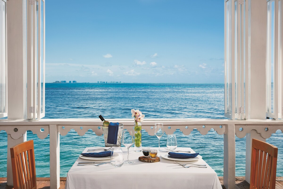 Zoetry Villa Rolandi dining table overlooking the ocean