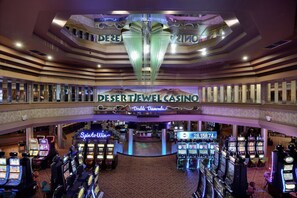 A casino interior with multiple gaming tables and a prominent sign for Desert Jewel Casino. - Windhoek Country Club (Windhoek)