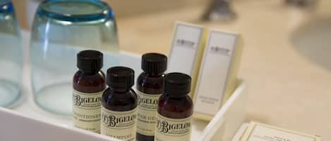 A display of Bigelow Apothecaries products including shampoo, body lotion, and soap.