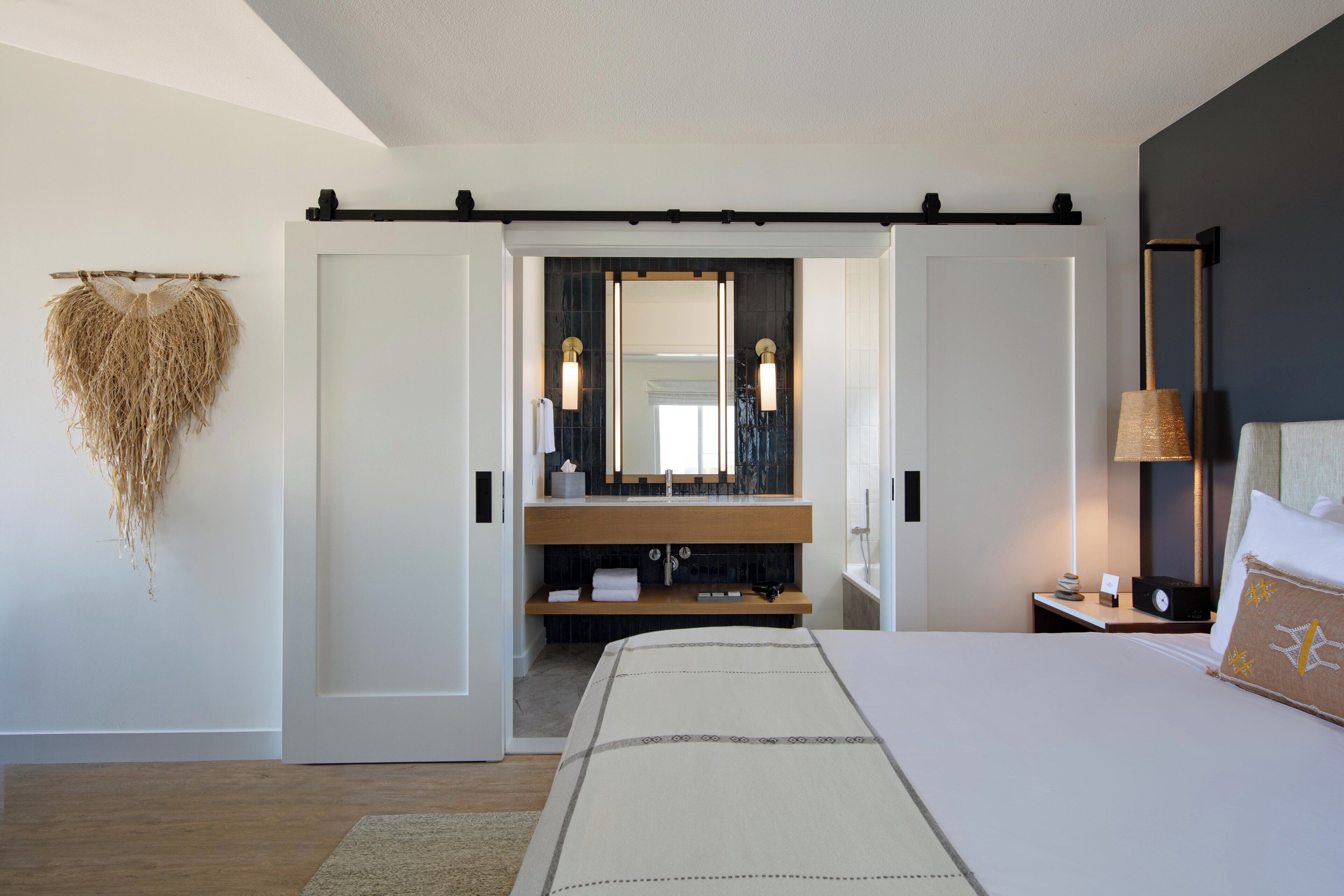 designer toiletries, hair dryer, bathrobes, slippers