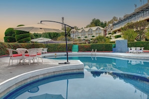 Outdoor pool, pool umbrellas, sun loungers