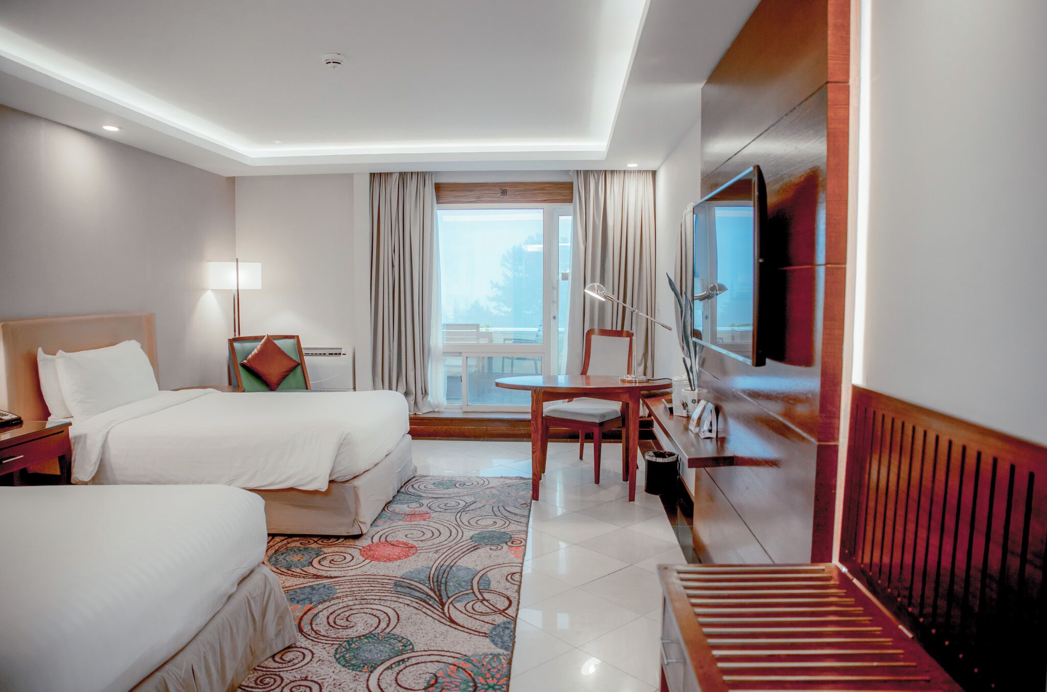 Deluxe Twin Room, Balcony, Garden View | Minibar, in-room safe, desk, laptop workspace