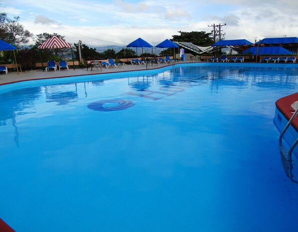 Outdoor pool, pool umbrellas, pool loungers