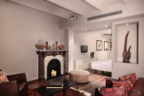 Apartamento, 1 quarto | Área de estar | TV de tela plana