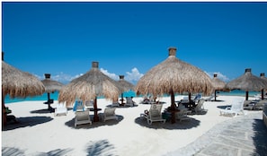 On the beach, white sand, free beach cabanas, sun-loungers