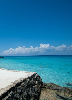 On the beach, white sand, free beach cabanas, sun loungers