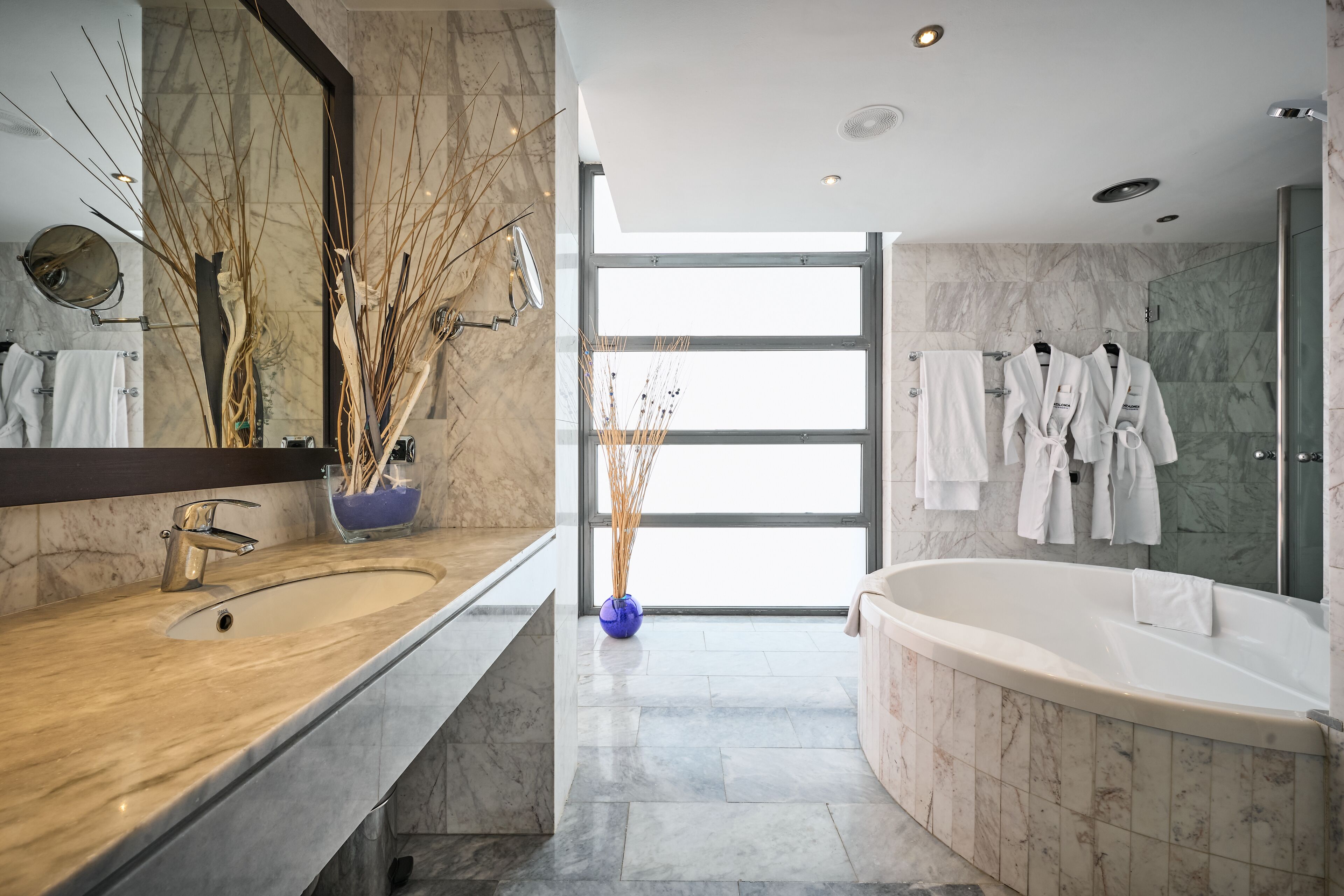 bathtub, eco-friendly toiletries, hair dryer, towels