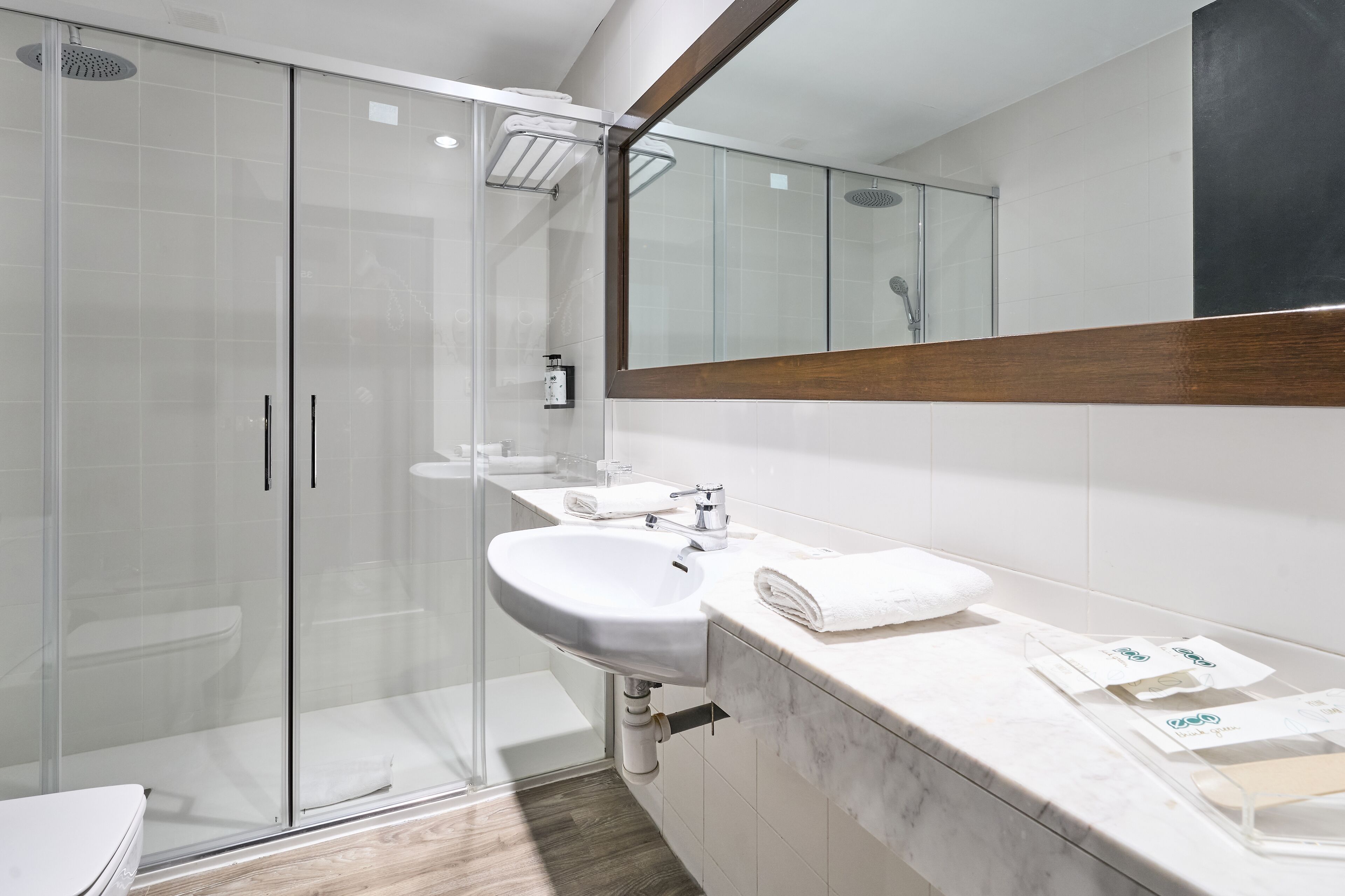 bathtub, eco-friendly toiletries, hair dryer, towels