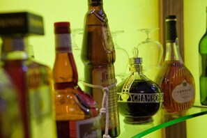 A collection of liquor bottles on a shelf. - Sunday London Paddington Hotel (London)
