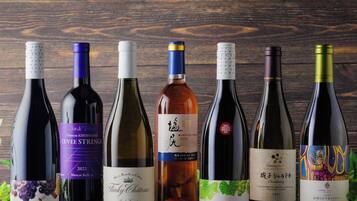 A collection of wine bottles on a wooden surface.