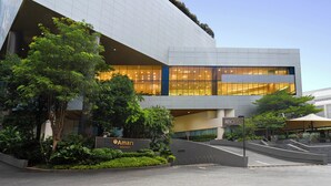 A modern building with a sign reading "Amari Bangkok." - Amari Bangkok (Bangkok)