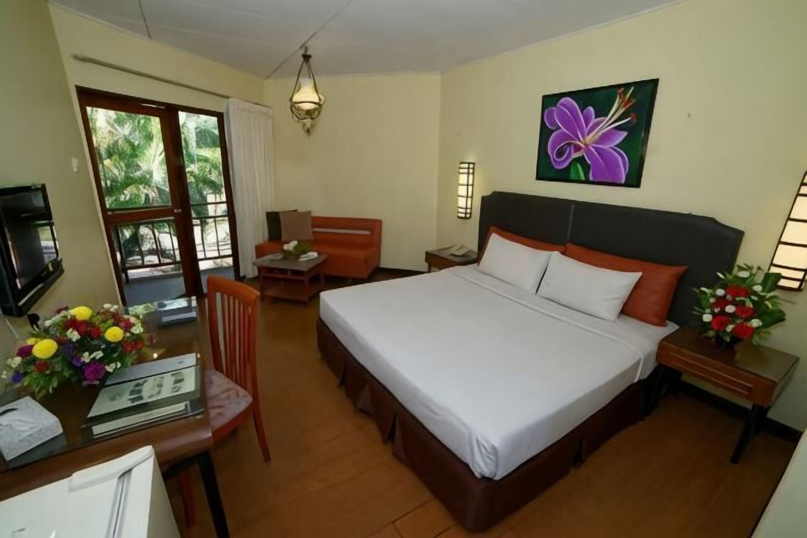 Minibar, desk, bed sheets