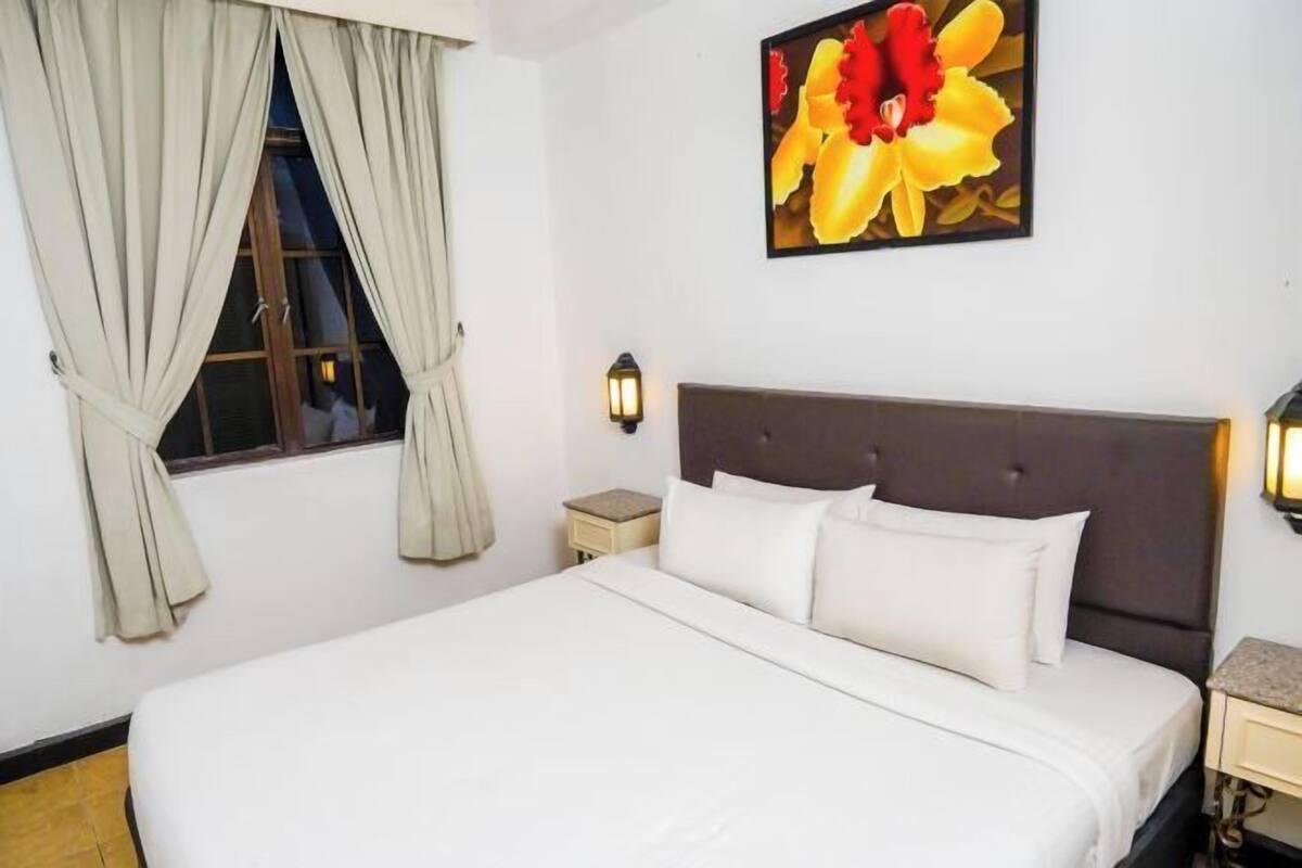 Minibar, desk, bed sheets