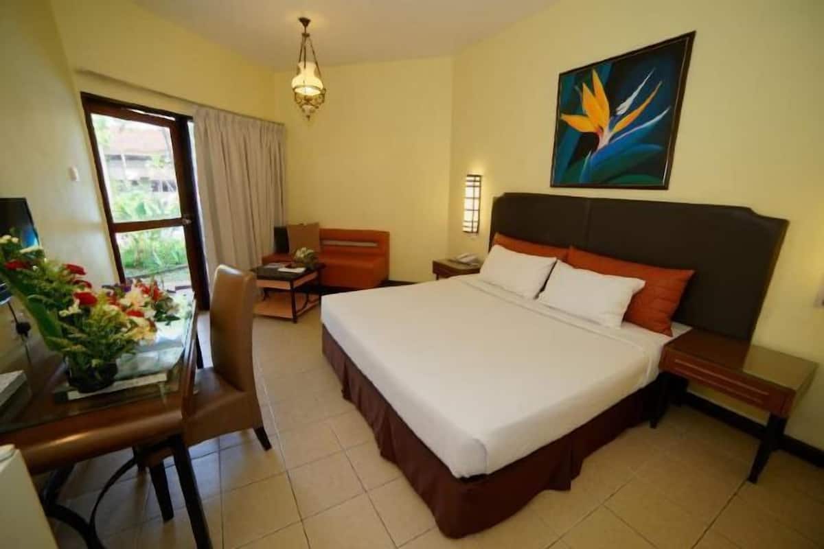 Minibar, desk, bed sheets