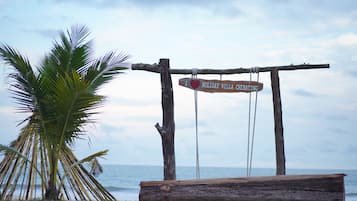 On the beach, free beach cabanas, beach umbrellas