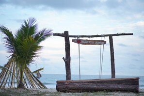 On the beach, free beach cabanas, beach umbrellas