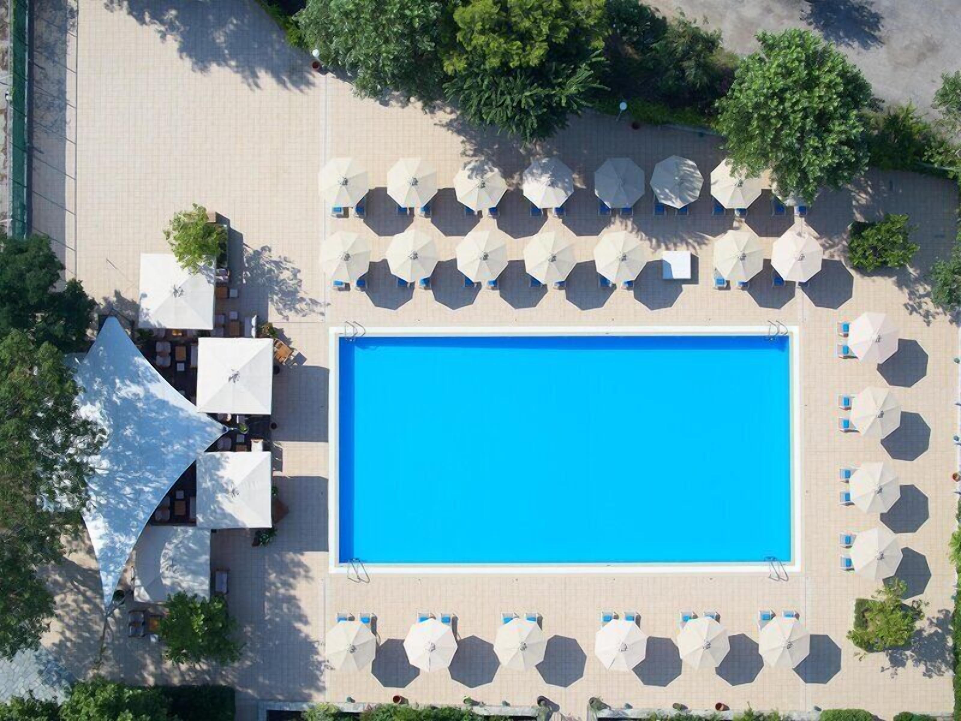 Indoor pool, seasonal outdoor pool, pool umbrellas, pool loungers
