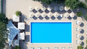 Indoor pool, seasonal outdoor pool, pool umbrellas, pool loungers