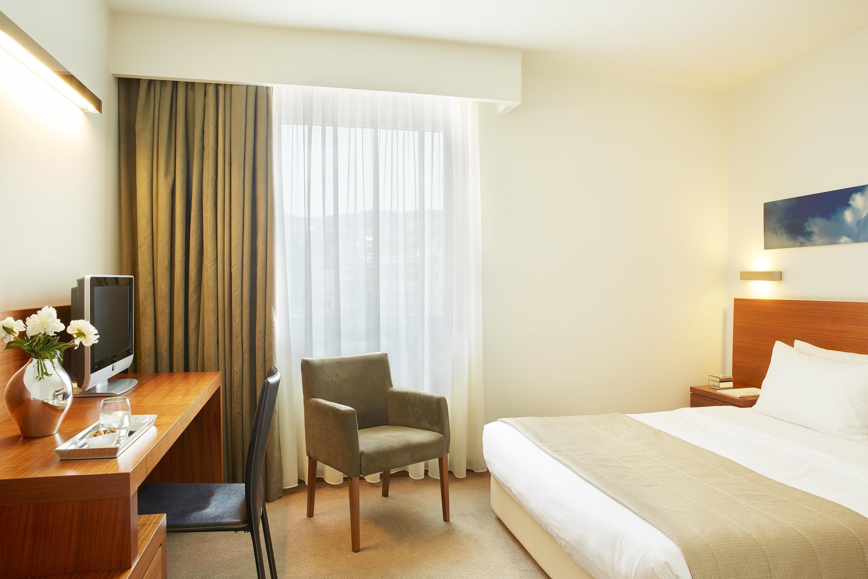 Room, City View | Minibar, in-room safe, desk, laptop workspace