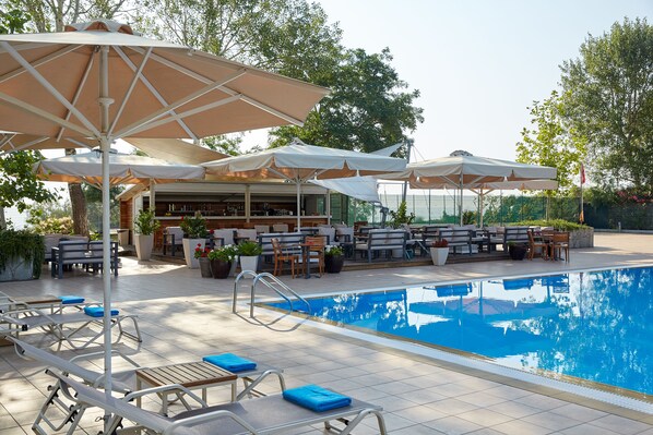 Indoor pool, seasonal outdoor pool, pool umbrellas, pool loungers