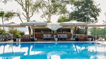 Indoor pool, seasonal outdoor pool, pool umbrellas, pool loungers