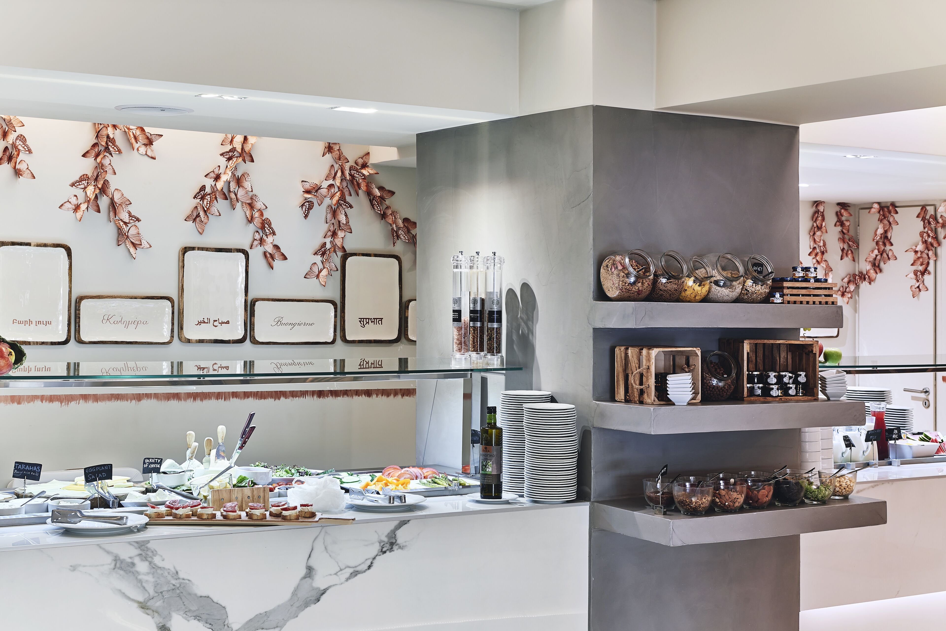 A buffet area with various food items and condiments.