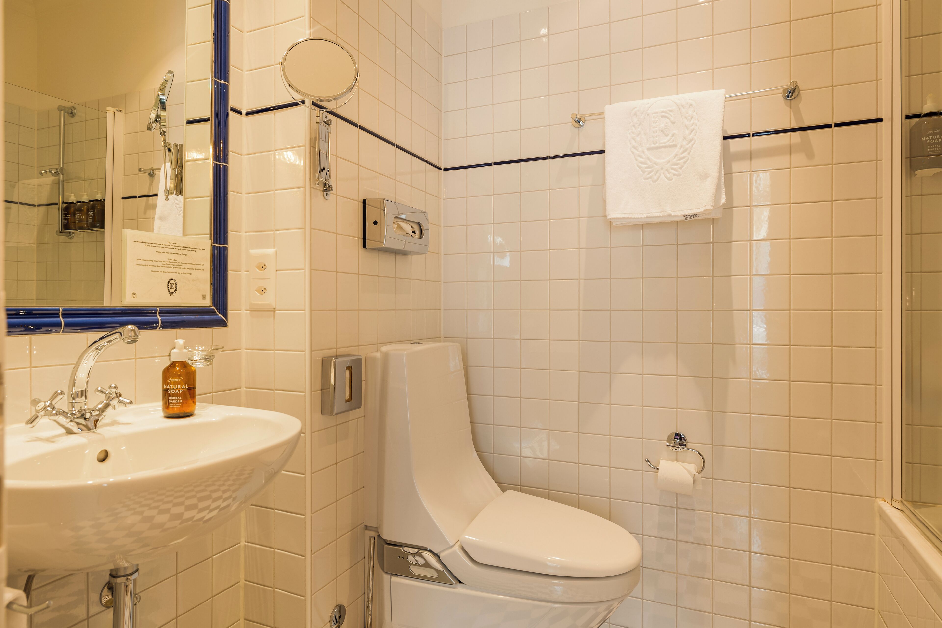 junior suite | bathroom | designer toiletries, hair dryer, towels