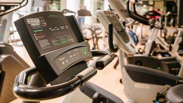 A stationary bike with a digital display and control panel.